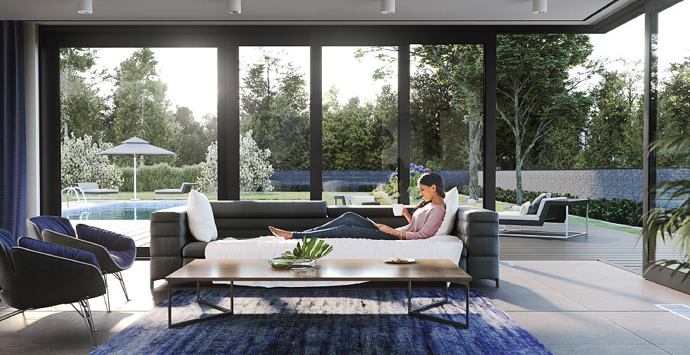 Salon ouvert sur une baie aluminium Visioglide — ambiance Aluhaus